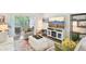 Bright living room with a view of nature, comfortable seating, and a modern entertainment center at 18187 Paradise Point Dr, Tampa, FL 33647