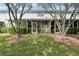 Relax on this screened lanai overlooking a manicured lawn with mature trees at 18187 Paradise Point Dr, Tampa, FL 33647