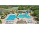 Aerial view of a large community pool with lounge chairs, a water slide and more at 18187 Paradise Point Dr, Tampa, FL 33647