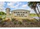 Community entrance sign with the words Heritage Isles Golf & Country Club at 18187 Paradise Point Dr, Tampa, FL 33647