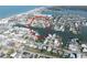 Overhead view highlighting the appeal of a waterfront community, showcasing homes with private boat docks, perfect for boating lovers at 187 175Th Terrace E Dr, Redington Shores, FL 33708