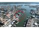 Aerial view featuring waterfront homes with private boat docks, nestled in a beautiful canal-lined neighborhood at 187 175Th Terrace E Dr, Redington Shores, FL 33708