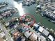Aerial view, property circled in red, highlighting its prime waterfront location and canal access with boat docks at 187 175Th Terrace E Dr, Redington Shores, FL 33708