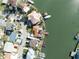Aerial view of waterfront homes with boat docks and boats on the canal at 187 175Th Terrace E Dr, Redington Shores, FL 33708