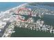 Capture the essence of waterfront living from this aerial view, featuring homes with private docks and easy access to the open water at 187 175Th Terrace E Dr, Redington Shores, FL 33708