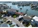 Stunning waterfront homes with private docks and boat access on a sunny day at 187 175Th Terrace E Dr, Redington Shores, FL 33708