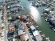 Aerial shot with property circled in red, showing waterfront access with dock, nestled in a vibrant coastal community at 187 175Th Terrace E Dr, Redington Shores, FL 33708