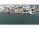 Stunning waterfront views showcase a home with a dock and the tranquil waters of the bay at 187 175Th Terrace E Dr, Redington Shores, FL 33708