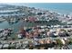 Aerial view of a waterfront residential area featuring beautiful homes with private boat docks and serene waterways at 187 175Th Terrace E Dr, Redington Shores, FL 33708