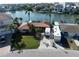 Aerial shot of a waterfront home with lush landscaping, RV parking, and peaceful canal views at 187 175Th Terrace E Dr, Redington Shores, FL 33708