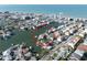 Stunning aerial view highlighting waterfront homes with boat docks, set in a charming coastal community by the sea at 187 175Th Terrace E Dr, Redington Shores, FL 33708