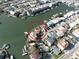 Stunning waterfront property featuring a private dock with boat access and beautifully landscaped grounds, circled in red for focus at 187 175Th Terrace E Dr, Redington Shores, FL 33708