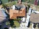 Aerial view of waterfront homes with boat docks, a private deck, and a well-kept lawn at 187 175Th Terrace E Dr, Redington Shores, FL 33708