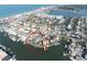 Aerial view circled in red, showcasing waterfront community with docks and proximity to the beach and intercoastal waters at 187 175Th Terrace E Dr, Redington Shores, FL 33708