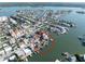 Aerial view property circled in red, showcasing waterfront home with dock and the neighborhood's close proximity to the bay at 187 175Th Terrace E Dr, Redington Shores, FL 33708