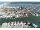 Aerial view of desirable waterfront homes with private docks on canal, offering stunning access to boating and relaxation at 187 175Th Terrace E Dr, Redington Shores, FL 33708