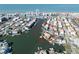 Beautiful aerial view showcasing waterfront homes with boat docks and coastal scenery in a vibrant residential neighborhood at 187 175Th Terrace E Dr, Redington Shores, FL 33708