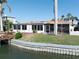 This property features a charming screened in lanai, outdoor seating, and private dock on the water at 187 175Th Terrace E Dr, Redington Shores, FL 33708