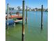 Rustic wooden dock featuring weathered posts on the waterfront at 187 175Th Terrace E Dr, Redington Shores, FL 33708