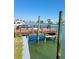 Waterfront dock with sturdy wooden posts and serene water views at 187 175Th Terrace E Dr, Redington Shores, FL 33708