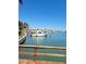 A large boat sits docked at a waterfront property in a quiet canal at 187 175Th Terrace E Dr, Redington Shores, FL 33708