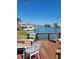 Relaxing waterfront dock with comfortable seating and scenic boat views at 187 175Th Terrace E Dr, Redington Shores, FL 33708