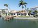 Waterfront home with private dock and seating, overlooking the tranquil canal waters at 187 175Th Terrace E Dr, Redington Shores, FL 33708