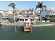 Waterfront home with private dock and seating, overlooking the tranquil canal waters at 187 175Th Terrace E Dr, Redington Shores, FL 33708