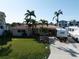 A well-kept home with a tile roof, vibrant landscaping, and ample RV parking in the driveway at 187 175Th Terrace E Dr, Redington Shores, FL 33708