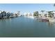 Scenic waterfront view of the canal with various buildings and boats along the shoreline on a clear day at 187 175Th Terrace E Dr, Redington Shores, FL 33708