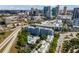 An aerial view of an apartment building with a pool, and the Tampa skyline in the background at 201 W Laurel St # 702, Tampa, FL 33602