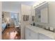 Bathroom with marble countertops and walk-in shower at 201 W Laurel St # 702, Tampa, FL 33602