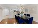 Bright dining area offering hardwood floors, glass table, and views of the kitchen at 201 W Laurel St # 702, Tampa, FL 33602