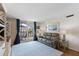Cozy living area with sliding glass doors leading to a private balcony, letting in natural light at 201 W Laurel St # 702, Tampa, FL 33602