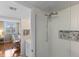 Walk-in shower featuring white-textured tile at 201 W Laurel St # 702, Tampa, FL 33602
