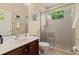 Bright bathroom featuring a glass shower and tile flooring with a window at 21654 Draycott Way, Land O Lakes, FL 34637