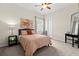 Bedroom with carpet flooring, neutral color walls and an artistic abstract painting at 21654 Draycott Way, Land O Lakes, FL 34637