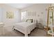 This is a beautifully staged bedroom with carpet, modern decor, and natural light at 21654 Draycott Way, Land O Lakes, FL 34637