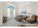 Bright and airy living room with large window, plush seating, and elegant decor at 21654 Draycott Way, Land O Lakes, FL 34637