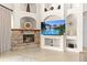 Living room includes stone fireplace, entertainment center and decorative shelving at 21654 Draycott Way, Land O Lakes, FL 34637