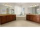 The main bathroom features dual vanities, a soaking tub, and a neutral color palette at 21654 Draycott Way, Land O Lakes, FL 34637
