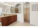 The main bathroom's shower has beautiful tile work, including a tiled floor, multiple shower heads, and a window at 21654 Draycott Way, Land O Lakes, FL 34637