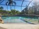 A pristine swimming pool featuring clear blue water and a -friendly beach entry at 21654 Draycott Way, Land O Lakes, FL 34637