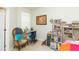 Bedroom featuring a desk, chair, and shelving with books at 2211 Kings Palace Dr, Riverview, FL 33578