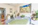 Comfortable bedroom with a study desk and an adjacent bathroom creating a private suite at 2211 Kings Palace Dr, Riverview, FL 33578