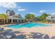 Resort-style community pool with ample seating and meticulously maintained landscaping, creating an inviting outdoor space at 2211 Kings Palace Dr, Riverview, FL 33578