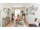 The dining room features hardwood floors, a chandelier, and neutral walls at 2211 Kings Palace Dr, Riverview, FL 33578