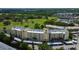 Aerial view showcasing the condo's proximity to a golf course and lush green surroundings at 225 Country Club Dr # 1104, Largo, FL 33771