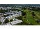 Elevated perspective of apartment complex next to a golf course and small waterway at 225 Country Club Dr # 1104, Largo, FL 33771