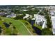 Panoramic aerial view of buildings with golf course and landscaping at 225 Country Club Dr # 1104, Largo, FL 33771